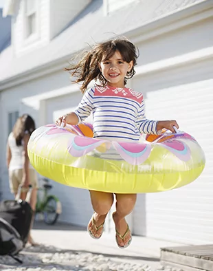 Northern Kentucky kid jumps for joy before her appointment with a pediatric dentist in Cold Spring, KY.