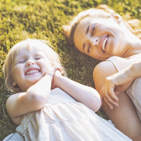 Cheerful mother takes her child to Pediatric Dental Center for pediatric laughing gas sedation dentistry in Burlington, KY.