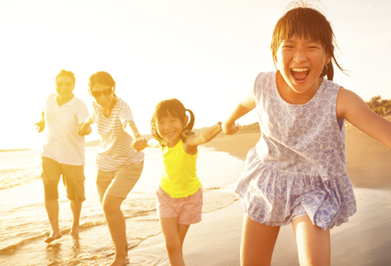 Northern Kentucky family at the beach after a pediatric dentistry visit in Crestview Hills.