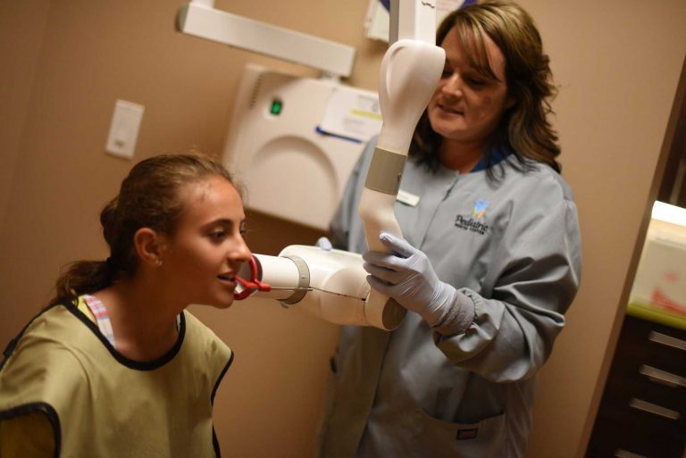 A child recieving dental imaging for comprehensive pediatric dentistry.