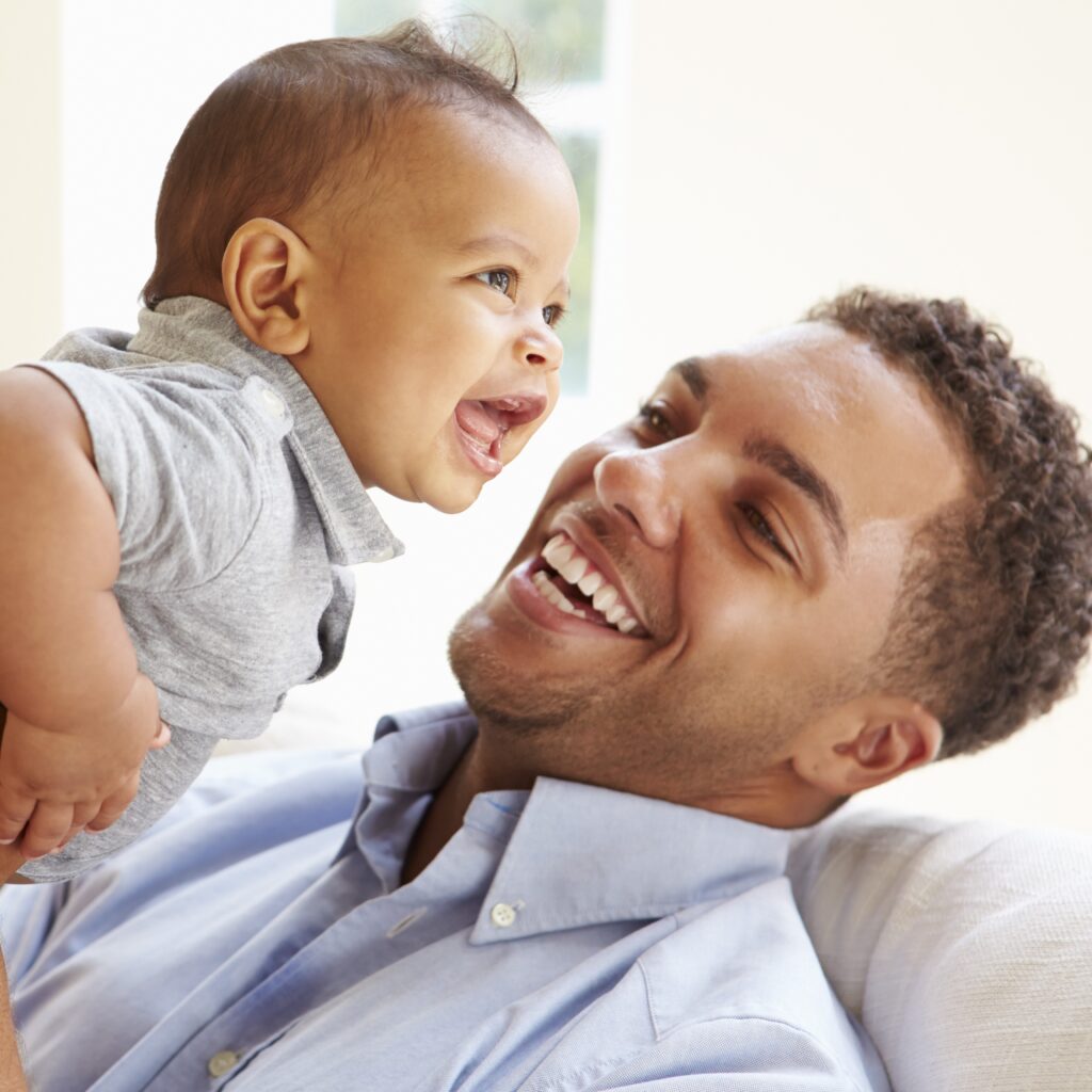 smiling father and baby